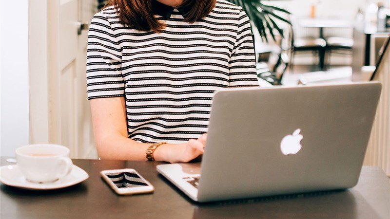 A Woman Using Macbook