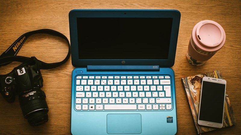 Office Desk with Camera, Notebook, and Mobile