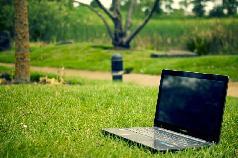 A Notebook Laptop on Grass