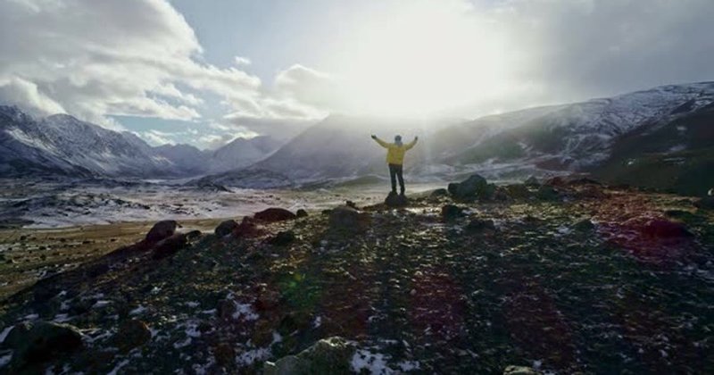 A Man Stands on Cliff